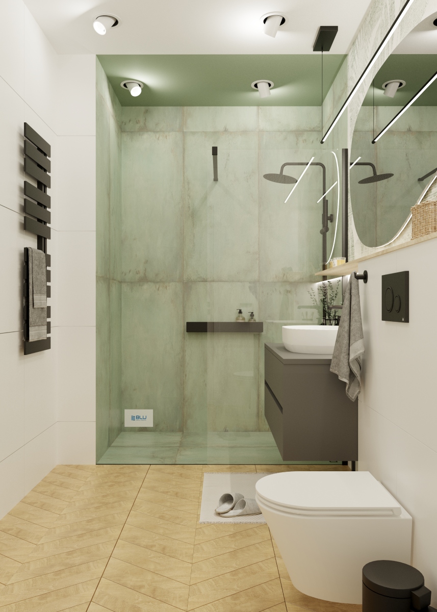 Biało - zielona łazienka z kabiną prysznicową.